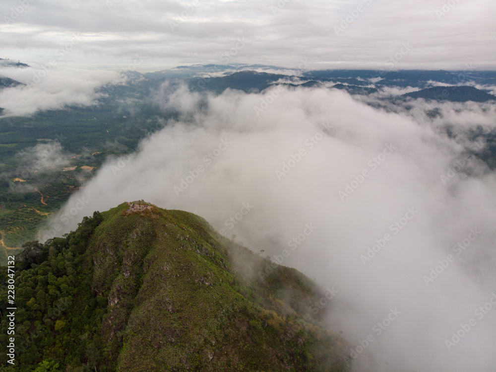 Aerial view of mountain with cloudy background. Aerial view of mountain with cloudy background.