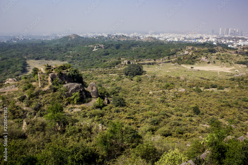 Fototapeta premium View from the Top of Golconda Fort at the Surrounding Gardens and the Modern Area of the City in Hyderabad, India
