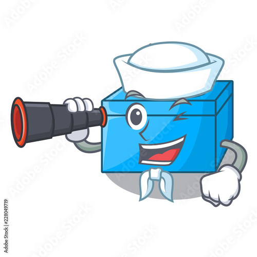 Sailor with binocular cartoon tissue box on a sideboard