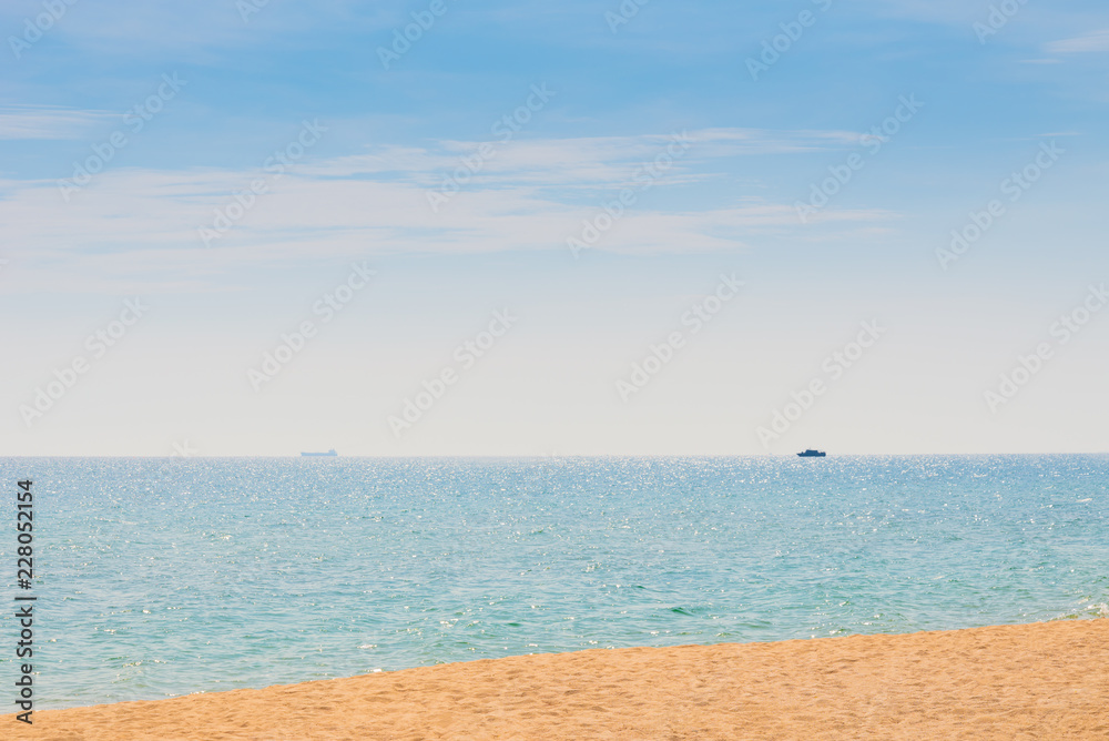 Abstract beach background. Yellow sand, blue sky and calm tropical beach landscape.Exotic nature concept.Location Satheep Thailand
