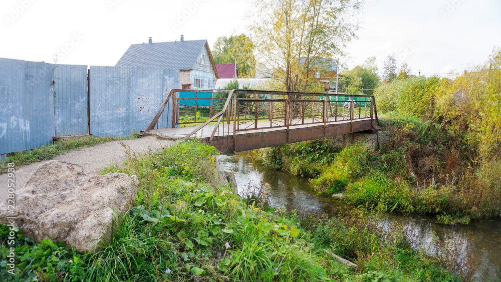 small iron bridge across the river