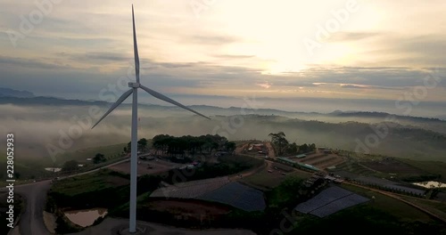 Clean energy from wind turbines to generate electricity. Aerial view  from Drone fly slider . photo