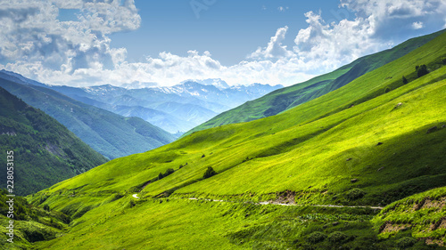 Alpine valley landscape. Scenery mountains on sunny bright day. Mountain landscape