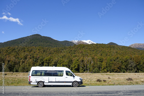 Campervan parked in a laybay on a remote road © plumchutney