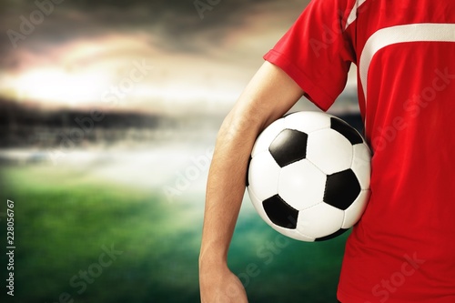 Young Male Soccer Player on blurred sport stadium background © BillionPhotos.com