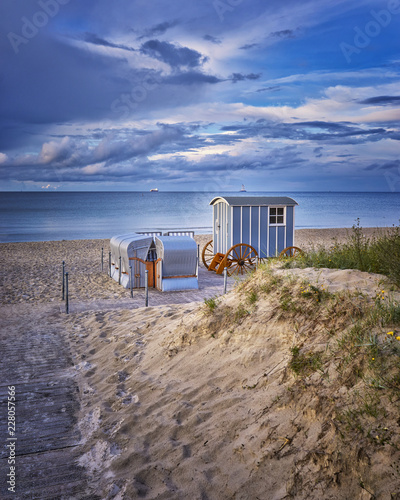 Fototapeta Naklejka Na Ścianę i Meble -  Romantic wedding registry office on the beach at the baltic sea with beach chair and blue clouds.