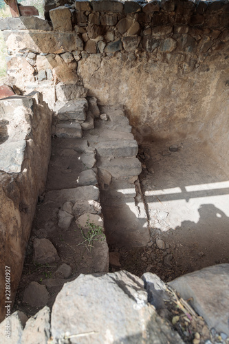 Remains  of bath for ritual ablutions - Mikvah - in ruins of the ancient Jewish city of Gamla on the Golan Heights destroyed by the armies of the Roman Empire in the 67th year AD photo