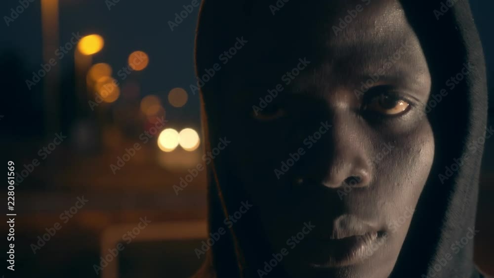Sad lonely american african man staring at camera-slow motion-city night Sad lonely american african man staring at camera-slow motion-city night
