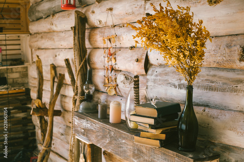 books  and oil lamp on the table. wooden background. vintage.autumn.