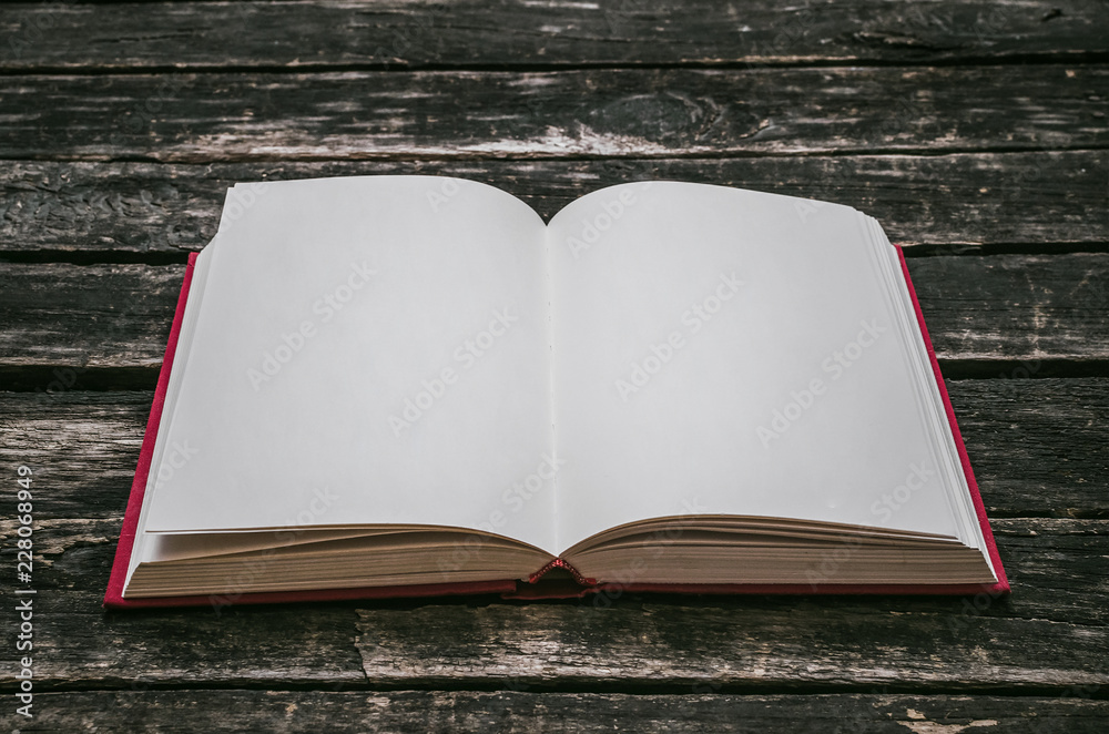 Open book with empty blank pages on the table. Open book with empty blank pages on the table.
