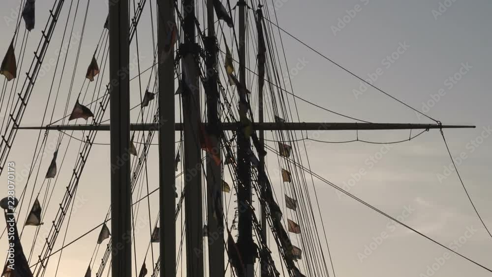 flags waving on the trees of the boat at sunset- Bristol,UK