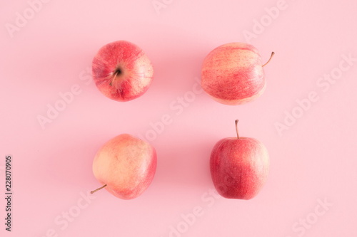 Autumn composition. Apples on pastel pink background. Autumn, fall creative concept. Flat lay, top view, copy space 