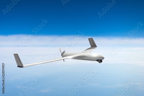 Unmanned military drone on patrol air sky at high altitude.