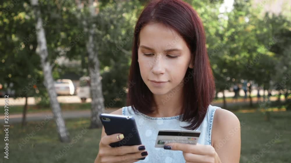 Attractive young woman use mobile phone doing online shopping with credit card. Attractive young woman use mobile phone doing online shopping with credit card.