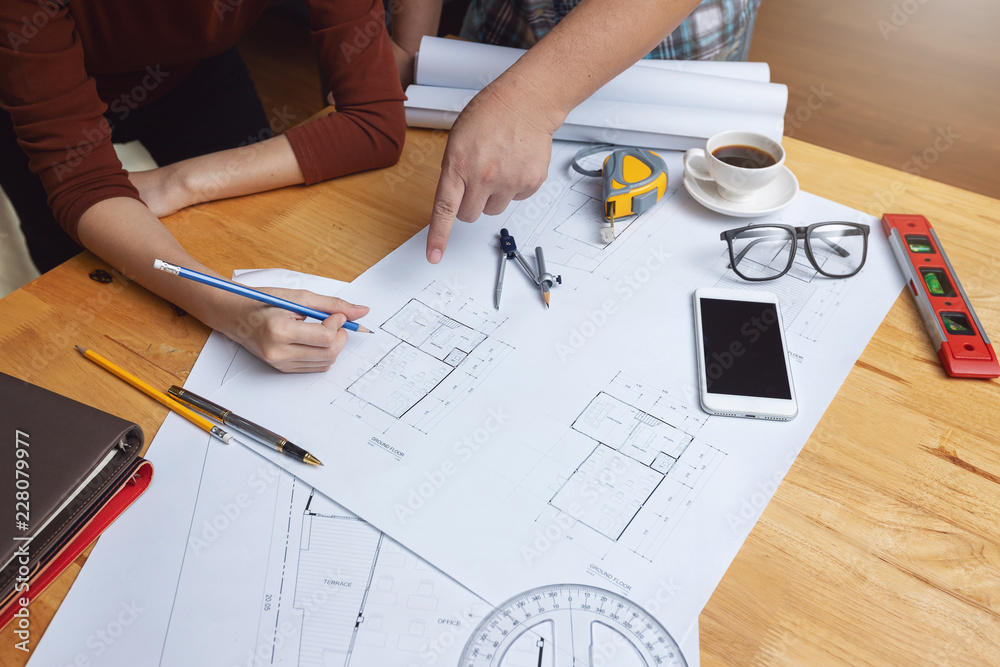 Engineer and Architect concept, Engineer Architects office team working with blueprints Engineer and Architect concept, Engineer Architects office team working with blueprints