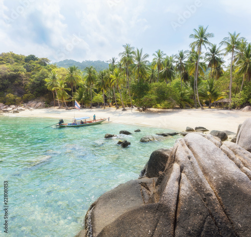 Asian tropical beach paradise in Thailand on sunny day