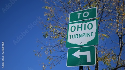 Establishing shot of the Ohio Turnpike directional sign