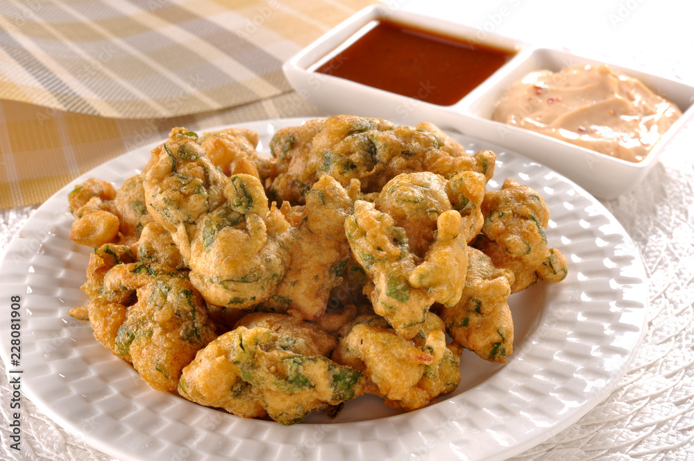 Pakora, a full nutrition spicy food with stuffed onion, chilli & gram flour Pakora, a full nutrition spicy food with stuffed onion, chilli & gram flour