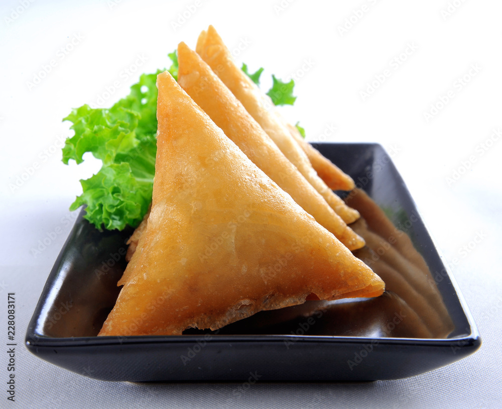 Samosa, Sambusa, Samboksa with a savory filling of chicken, mince
