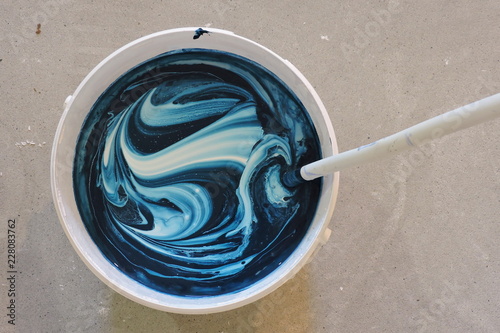 White paint with blue dye photo