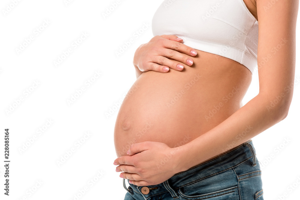 partial view of pregnant woman touching her belly isolated on white partial view of pregnant woman touching her belly isolated on white