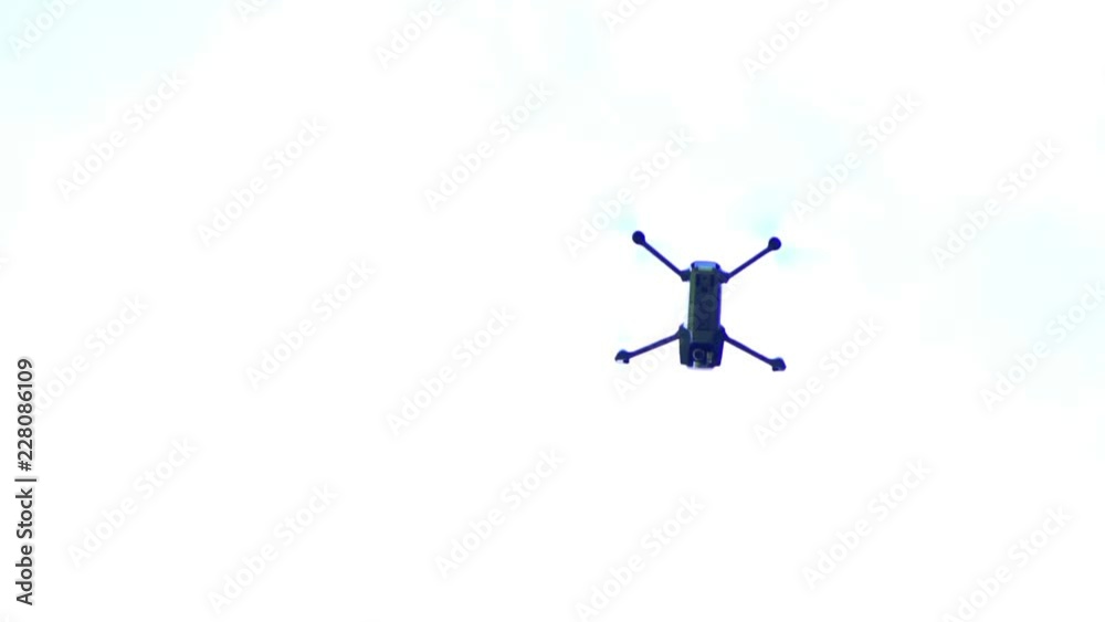 drone quadroopter flies in the sky. Shoots video drone quadroopter flies in the sky. Shoots video
