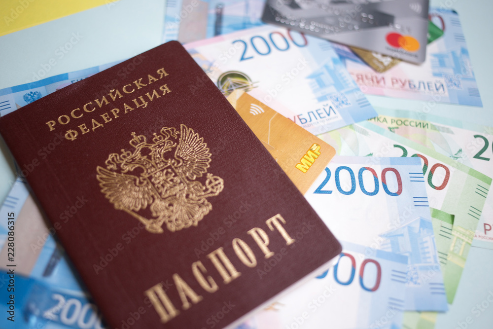 Moscow, Russia- 08 28 2018: Russian passport. The Russian Currency, including the new 2000 ruble-denominated promissory notes. The MIR credit card Moscow, Russia- 08 28 2018: Russian passport. The Russian Currency, including the new 2000 ruble-denominated promissory notes. The MIR credit card