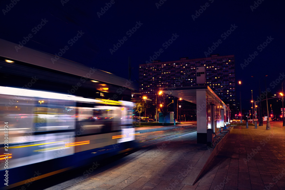 public transport metropolis, traffic and blurry lights train at night.