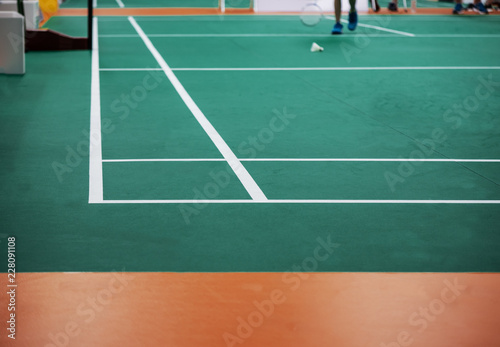 Indoor badminton court,shuttle cock on the floor, selective focus