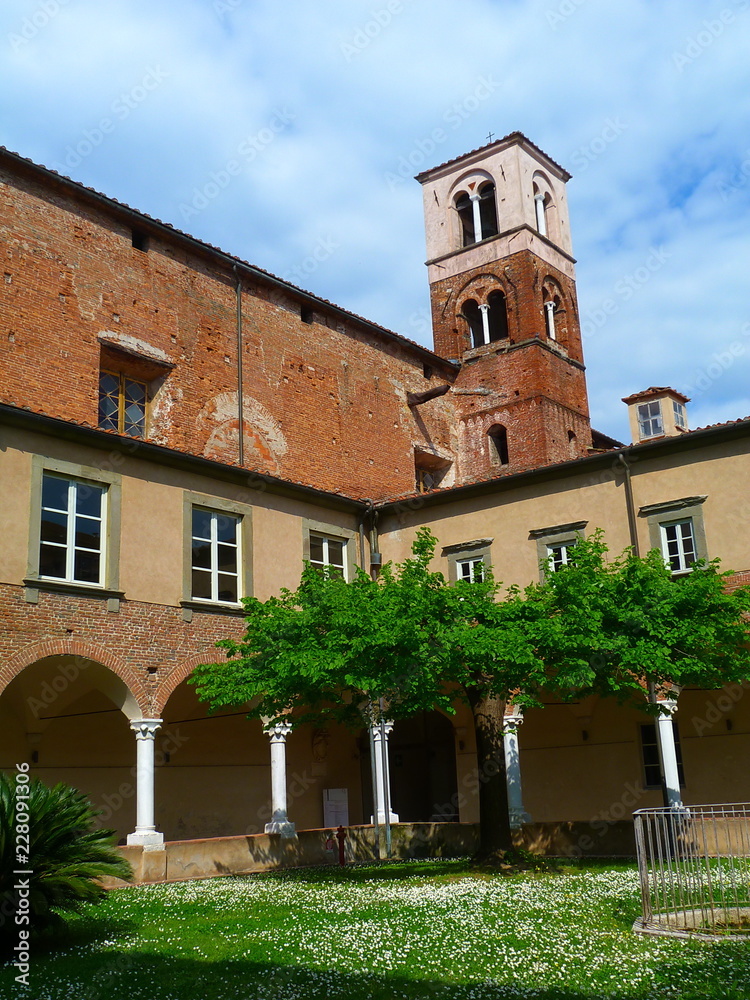 Courtyard and bell tower of the cathedral of S Martino, Lucca, Italy Courtyard and bell tower of the cathedral of S Martino, Lucca, Italy