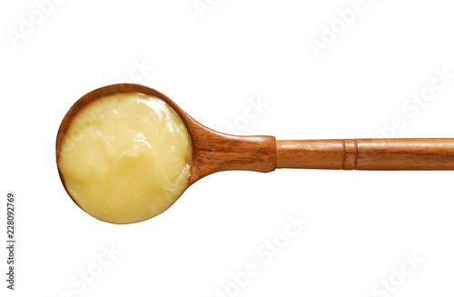 Pure Ghee in Spoon in wooden spoon