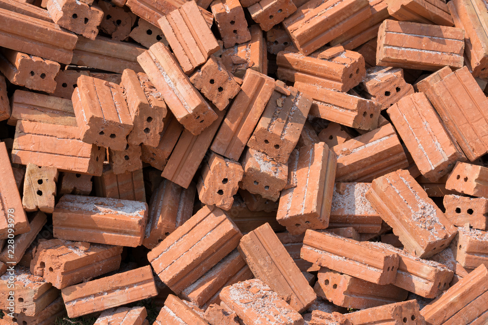 group of red bricks on construction site group of red bricks on construction site
