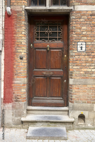 old door in brick wall