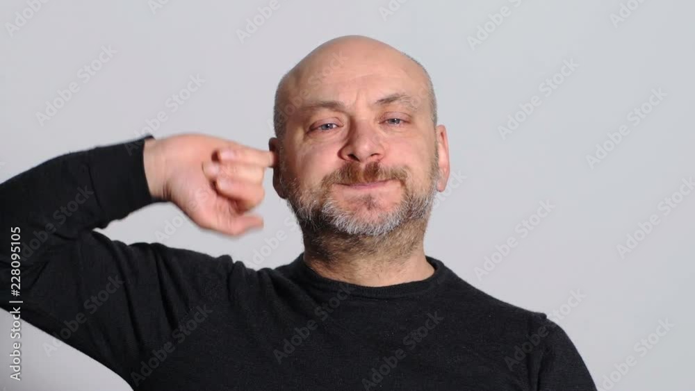 funny and humorous man who fills his ears with pinkies funny and humorous man who fills his ears with pinkies