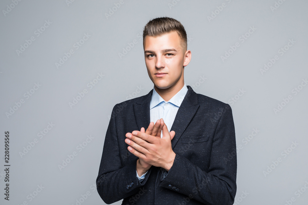 Happy young businessman standing and applauding on white background Happy young businessman standing and applauding on white background