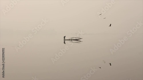 Fisherman fishing on a lake
