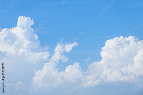 Rain clouds forming with blue sky background