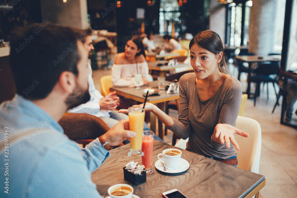 Young happy couple at a date in a coffee shop Young happy couple at a date in a coffee shop