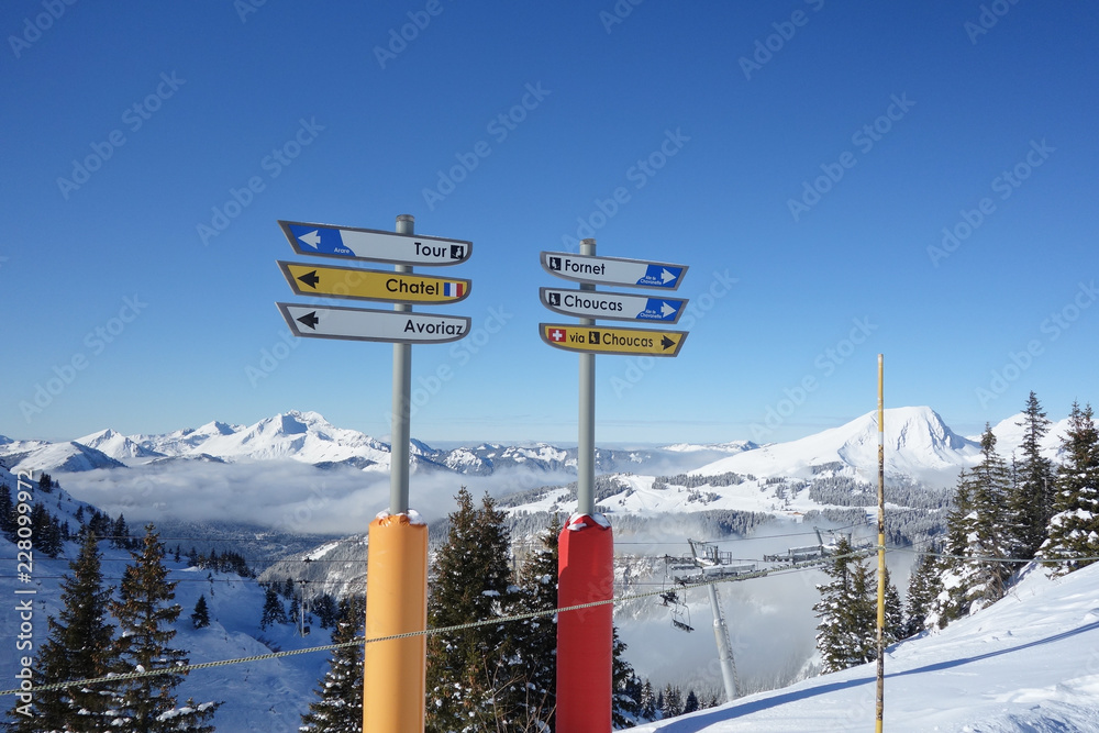 Direction signs for skiers on the slopes above Avoriaz in the French Alps. - obrazy, fototapety, plakaty 