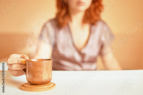 Woman drink coffee in bed