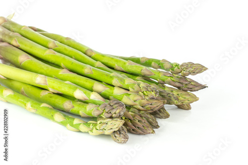 Bundle of lot of whole fresh green asparagus spear isolated on white background