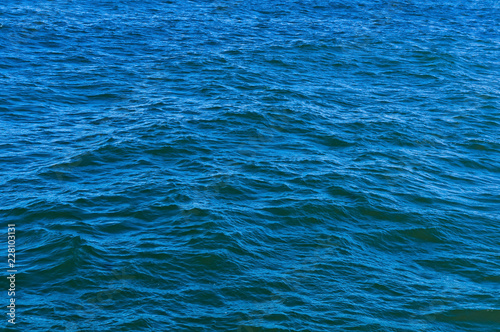 Water surface, backgrounds. Blue sea water. The ripples on the water.
