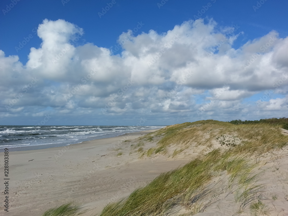 Seascape on the Baltic coast. Nature preserve with long sandy seashore Kursiu Nerija, Curonian Spit. Seascape on the Baltic coast. Nature preserve with long sandy seashore Kursiu Nerija, Curonian Spit.