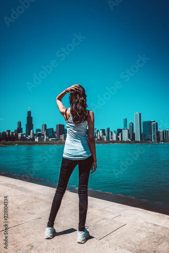 Fit woman standing against cityscape of Chicago