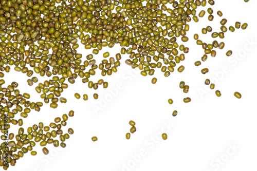 Lot of whole dry green mung beans left upper corner flatlay isolated on white background photo