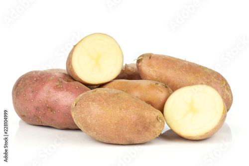 Group of lot of whole two halves of fresh red potato francelina variety isolated on white background