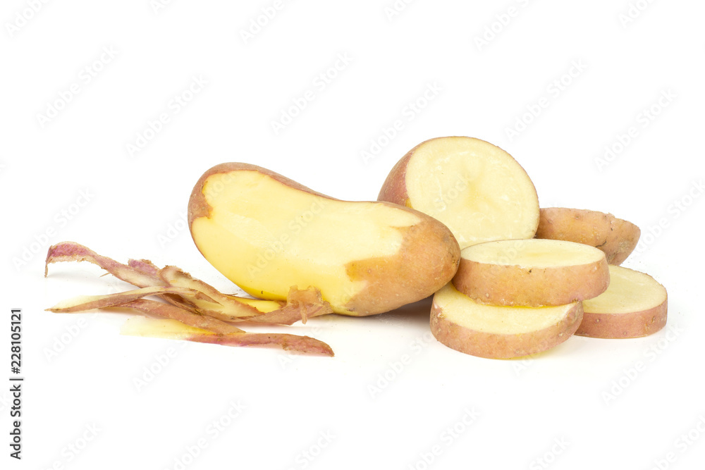 Group of one whole one half four slices of fresh red potato francelina variety one is peeled isolated on white background