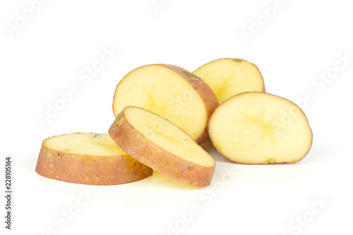 Group of five slices of fresh red potato francelina variety isolated on white background