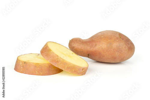 Group of one whole two slices of fresh red potato francelina variety isolated on white background