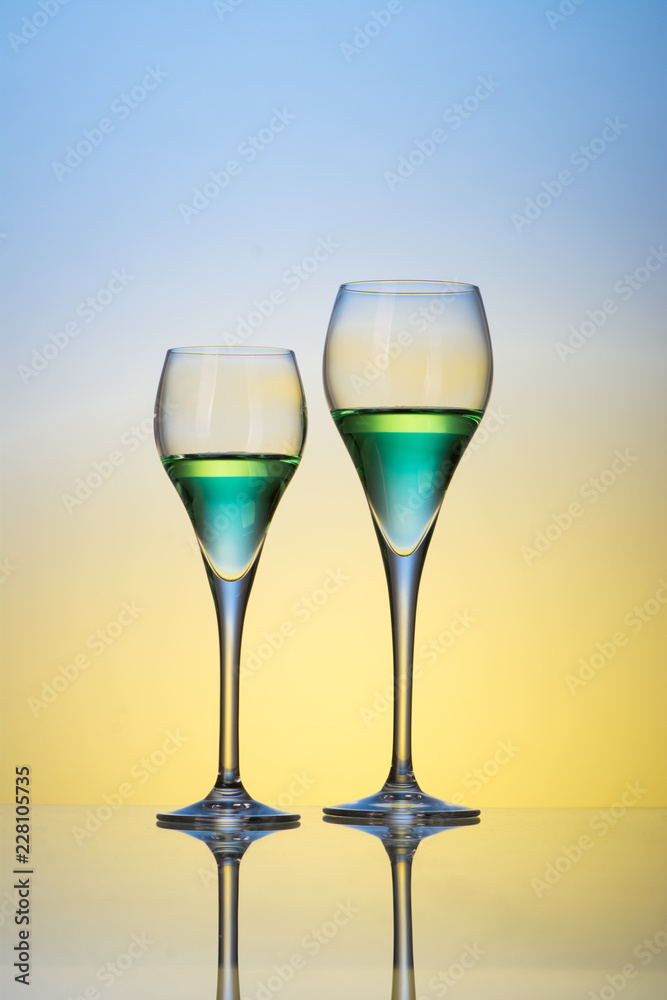 two glasses with cocktails